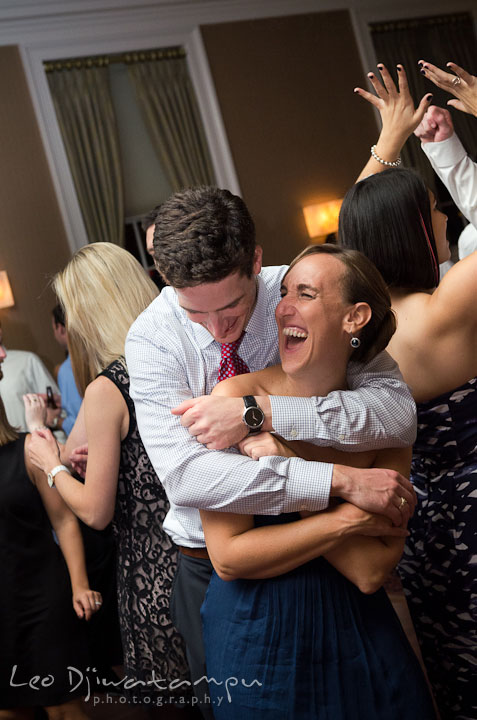 Maid of honor and her fiancé dancing and laughing. The Tidewater Inn Wedding, Easton Maryland, reception photo coverage of Kelsey and Jonnie by wedding photographers of Leo Dj Photography.