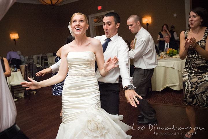 Bride and groom having fun dancing. The Tidewater Inn Wedding, Easton Maryland, reception photo coverage of Kelsey and Jonnie by wedding photographers of Leo Dj Photography.