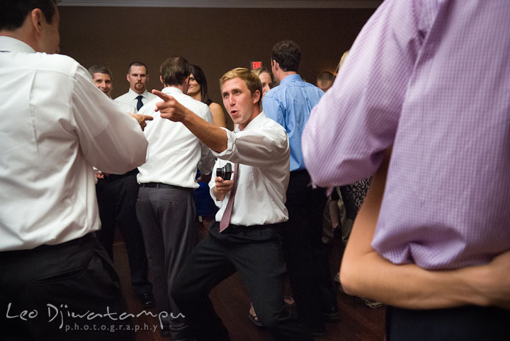 Guest dancing with groom. The Tidewater Inn Wedding, Easton Maryland, reception photo coverage of Kelsey and Jonnie by wedding photographers of Leo Dj Photography.