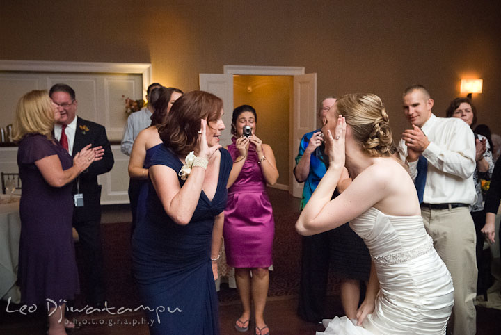 Bride and mother singing along and dancing. The Tidewater Inn Wedding, Easton Maryland, reception photo coverage of Kelsey and Jonnie by wedding photographers of Leo Dj Photography.