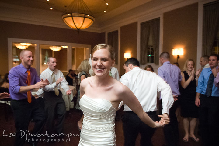 Bride and groom twirling around while dancing. The Tidewater Inn Wedding, Easton Maryland, reception photo coverage of Kelsey and Jonnie by wedding photographers of Leo Dj Photography.