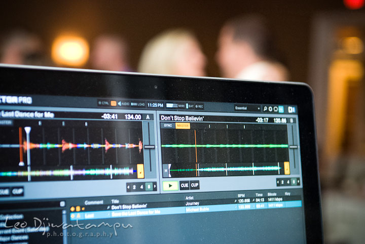 DJ's laptop showing song list Don't Stop Believin's song by Journey. The Tidewater Inn Wedding, Easton Maryland, reception photo coverage of Kelsey and Jonnie by wedding photographers of Leo Dj Photography.