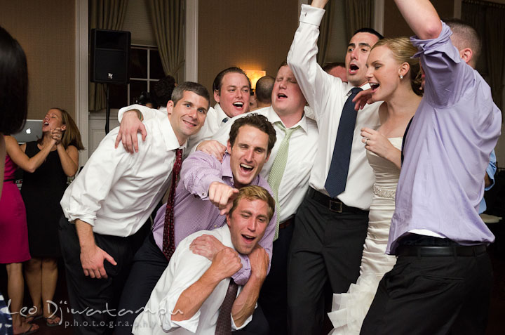 Bride, groom, and guests singing Don't Stop Believin' by Journey. The Tidewater Inn Wedding, Easton Maryland, reception photo coverage of Kelsey and Jonnie by wedding photographers of Leo Dj Photography.