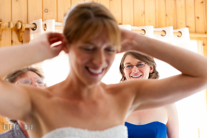 Bride fixing her veil, helped by sister and Mother. Riverhouse Pavilion wedding photos at Easton, Eastern Shore, Maryland by photographers of Leo Dj Photography. http://leodjphoto.com