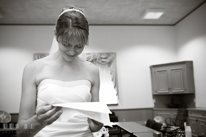 Bride reading letter from the Groom. St. Mark United Methodist Church wedding photos at Easton, Eastern Shore, Maryland by photographers of Leo Dj Photography. http://leodjphoto.com