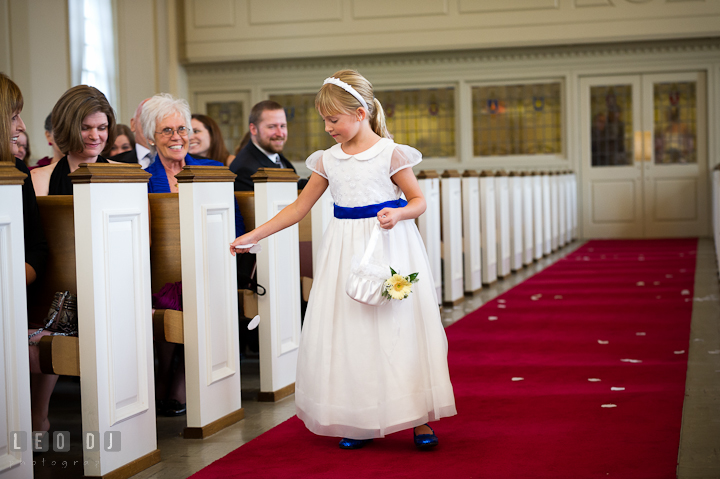 Flower girl spread flower petals while observed by smiling guests. St. Mark United Methodist Church wedding photos at Easton, Eastern Shore, Maryland by photographers of Leo Dj Photography. http://leodjphoto.com