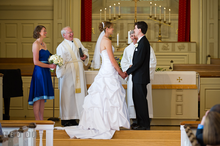 Bride and Groom holding hands and looking at each other. St. Mark United Methodist Church wedding photos at Easton, Eastern Shore, Maryland by photographers of Leo Dj Photography. http://leodjphoto.com