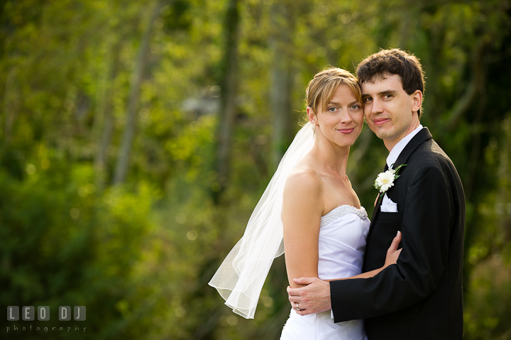 Bride and Groom posing for the camera. Riverhouse Pavilion wedding photos at Easton, Eastern Shore, Maryland by photographers of Leo Dj Photography. http://leodjphoto.com