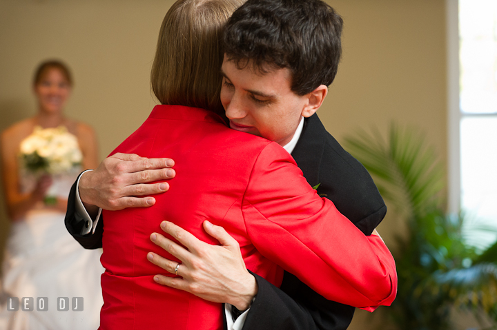 Mother of Groom hugging son. Riverhouse Pavilion wedding photos at Easton, Eastern Shore, Maryland by photographers of Leo Dj Photography. http://leodjphoto.com