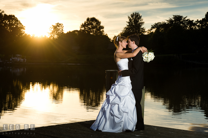 Bride and Groom at the pier during sunset. Riverhouse Pavilion wedding photos at Easton, Eastern Shore, Maryland by photographers of Leo Dj Photography. http://leodjphoto.com