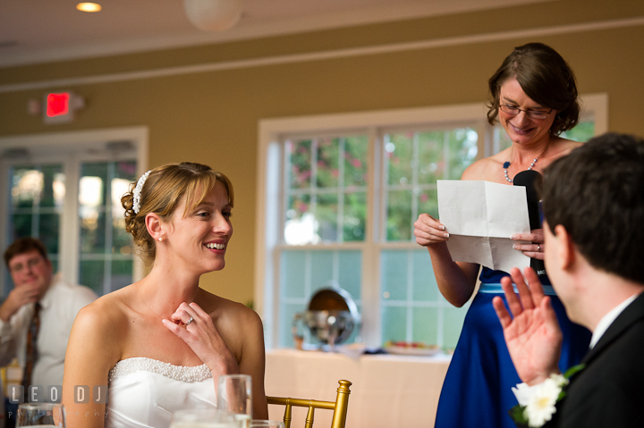 Bride and Groom smiling, listening to speech. Riverhouse Pavilion wedding photos at Easton, Eastern Shore, Maryland by photographers of Leo Dj Photography. http://leodjphoto.com