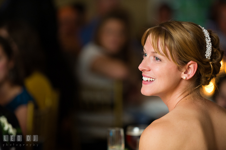 Bride laughing listening to speech. Riverhouse Pavilion wedding photos at Easton, Eastern Shore, Maryland by photographers of Leo Dj Photography. http://leodjphoto.com