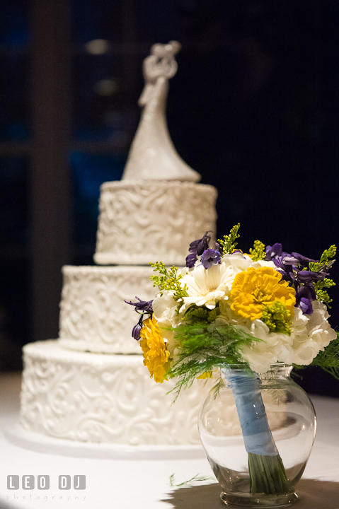 Flower bouquet by the wedding cake. Riverhouse Pavilion wedding photos at Easton, Eastern Shore, Maryland by photographers of Leo Dj Photography. http://leodjphoto.com