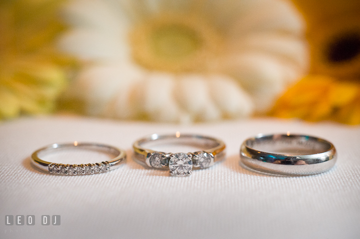 Close up shot of the engagement ring, wedding ring and wedding band. Riverhouse Pavilion wedding photos at Easton, Eastern Shore, Maryland by photographers of Leo Dj Photography. http://leodjphoto.com