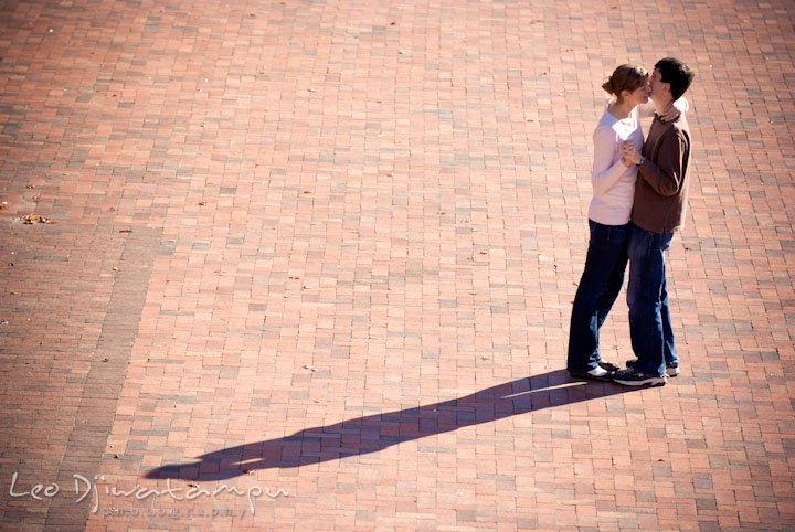 Engaged guy dancing with his fiancée. Pre-wedding engagement photo session at Washington College and Chestertown, Maryland, by wedding photographer Leo Dj Photography.