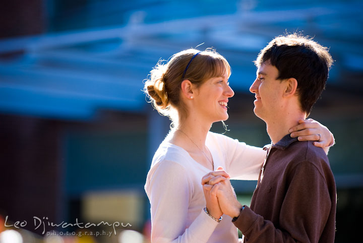 Engaged girl and her fiancé dancing. Pre-wedding engagement photo session at Washington College and Chestertown, Maryland, by wedding photographer Leo Dj Photography.