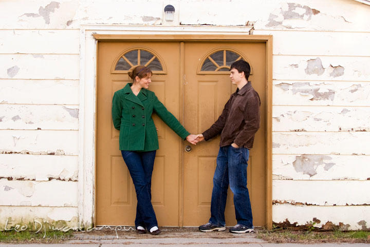 Engaged guy holding his fiancee. Pre-wedding engagement photo session at Washington College and Chestertown, Maryland, by wedding photographer Leo Dj Photography.