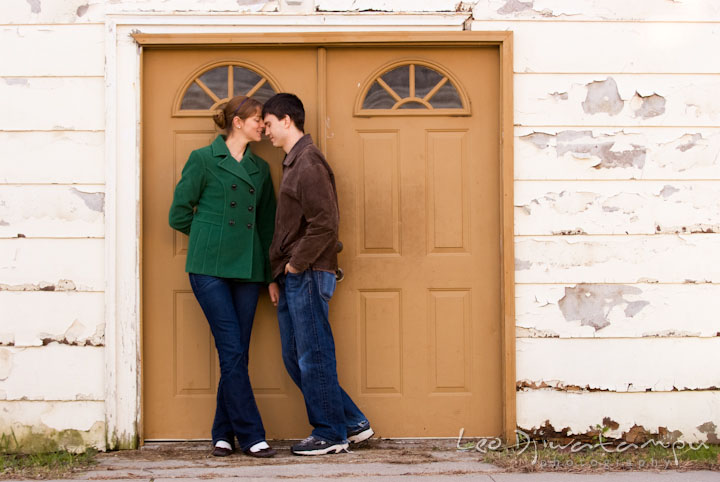 Engaged girl cuddling with her fiance. Pre-wedding engagement photo session at Washington College and Chestertown, Maryland, by wedding photographer Leo Dj Photography.