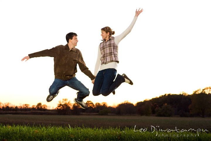 Engaged guy and girl jumping high. Pre-wedding engagement photo session at Washington College and Chestertown, Maryland, by wedding photographer Leo Dj Photography.