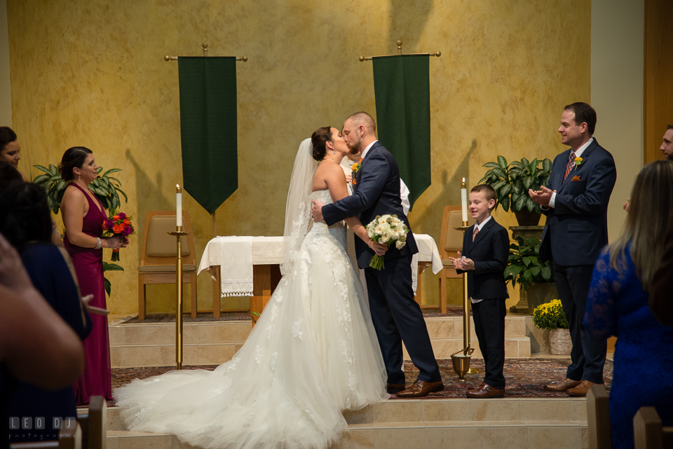 St Andrew by the Bay wedding ceremony Bride and Groom first kiss photo by Leo Dj Photography.