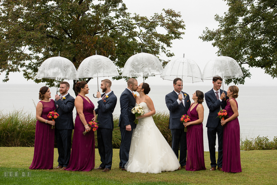 Chesapeake Bay Beach Club wedding party with Bride and Groom kissing photo by Leo Dj Photography.