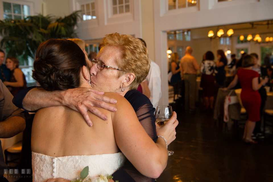 Chesapeake Bay Beach Club grandmother hugged and kissed Bride photo by Leo Dj Photography.