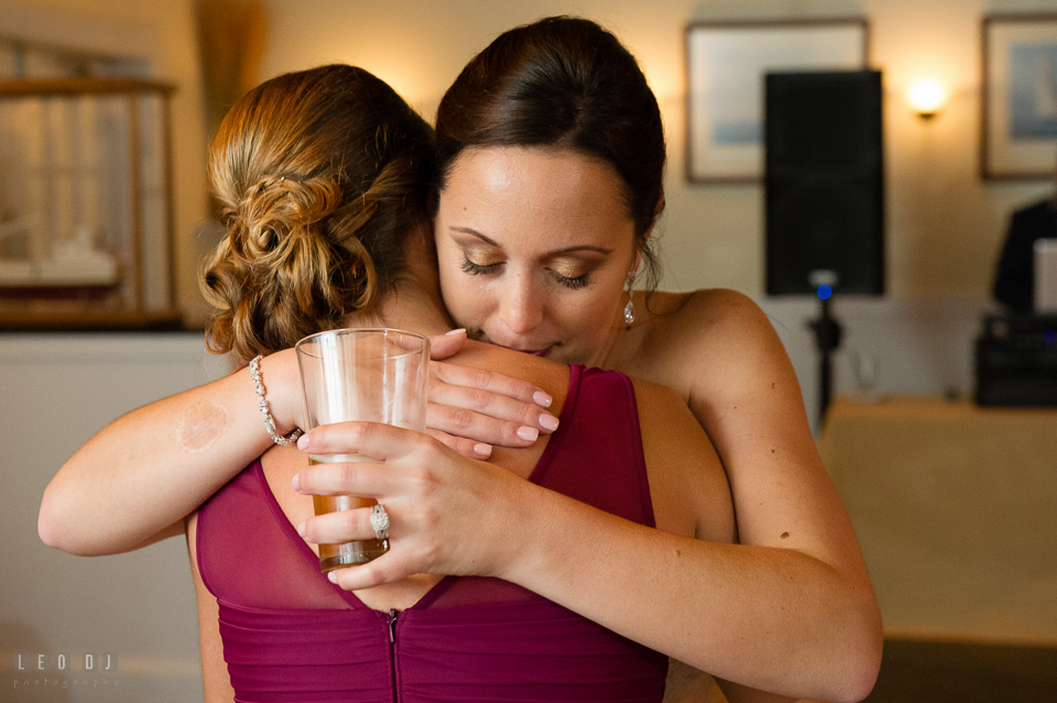 Chesapeake Bay Beach Club Bride hugging bridesmaid photo by Leo Dj Photography.