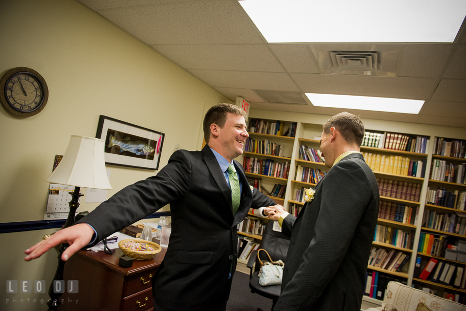 Best Man helping Groom clean up lints from jacket. Fisherman's Inn, Safe Harbor Church, Kent Island, Eastern Shore Maryland, wedding reception and ceremony photo, by wedding photographers of Leo Dj Photography. http://leodjphoto.com