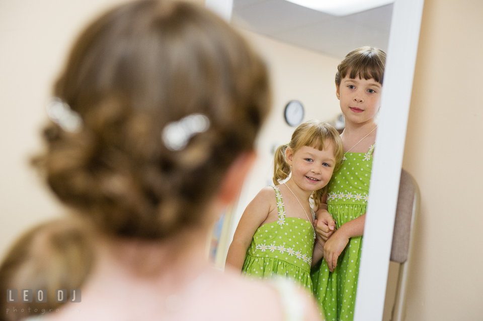 Flower girls looking at the mirror. Fisherman's Inn, Safe Harbor Church, Kent Island, Eastern Shore Maryland, wedding reception and ceremony photo, by wedding photographers of Leo Dj Photography. http://leodjphoto.com