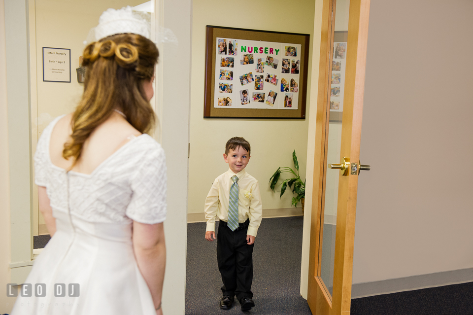 Bride meeting ring bearer boy. Fisherman's Inn, Safe Harbor Church, Kent Island, Eastern Shore Maryland, wedding reception and ceremony photo, by wedding photographers of Leo Dj Photography. http://leodjphoto.com