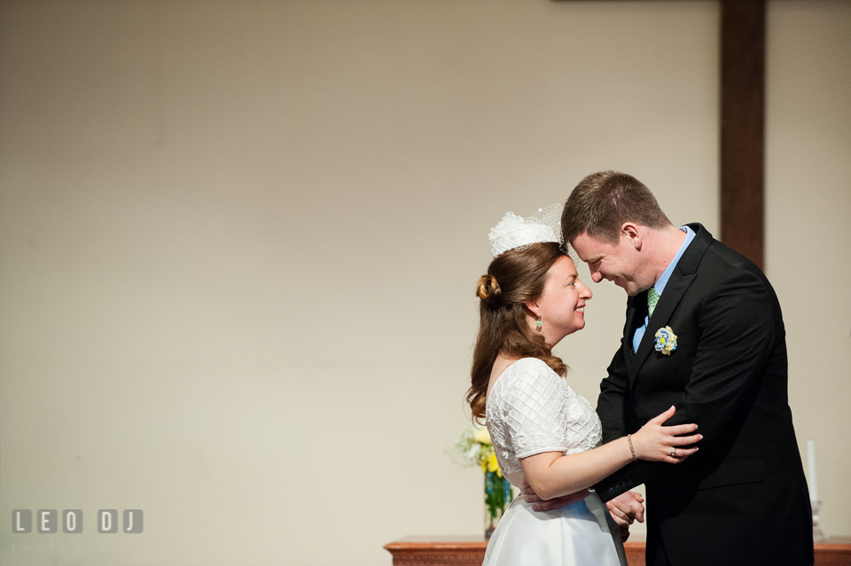 Bride and Groom smiling and hugging during ceremony. Fisherman's Inn, Safe Harbor Church, Kent Island, Eastern Shore Maryland, wedding reception and ceremony photo, by wedding photographers of Leo Dj Photography. http://leodjphoto.com