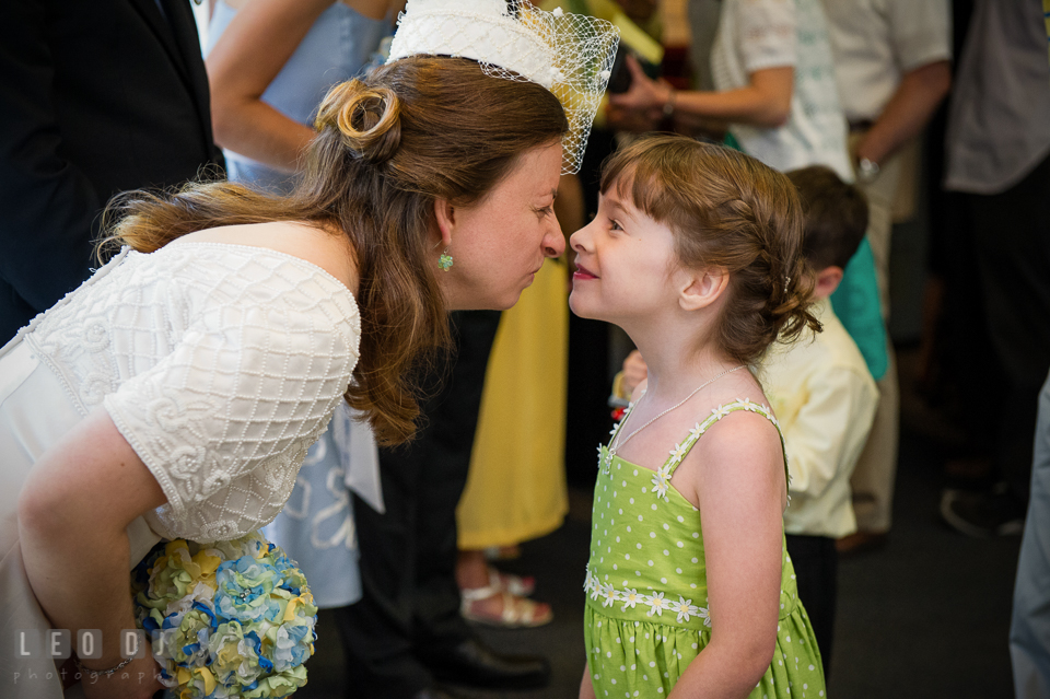 Bride nose cuddle with her niece, the flower girl . Fisherman's Inn, Safe Harbor Church, Kent Island, Eastern Shore Maryland, wedding reception and ceremony photo, by wedding photographers of Leo Dj Photography. http://leodjphoto.com