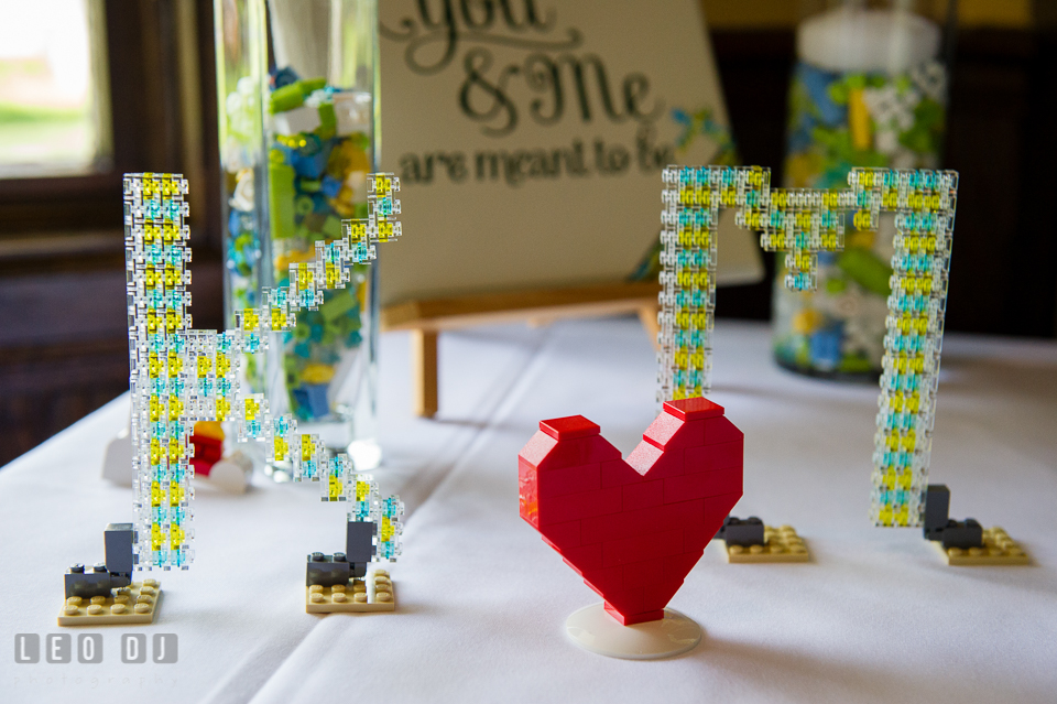 Table decor of initials of Bride and Groom's name and heart made out of LEGO. Fisherman's Inn, Safe Harbor Church, Kent Island, Eastern Shore Maryland, wedding reception and ceremony photo, by wedding photographers of Leo Dj Photography. http://leodjphoto.com