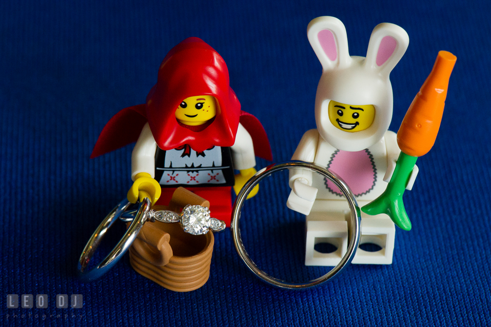 Wedding bands and engagement ring displayed with LEGO mini figures. Fisherman's Inn, Safe Harbor Church, Kent Island, Eastern Shore Maryland, wedding reception and ceremony photo, by wedding photographers of Leo Dj Photography. http://leodjphoto.com