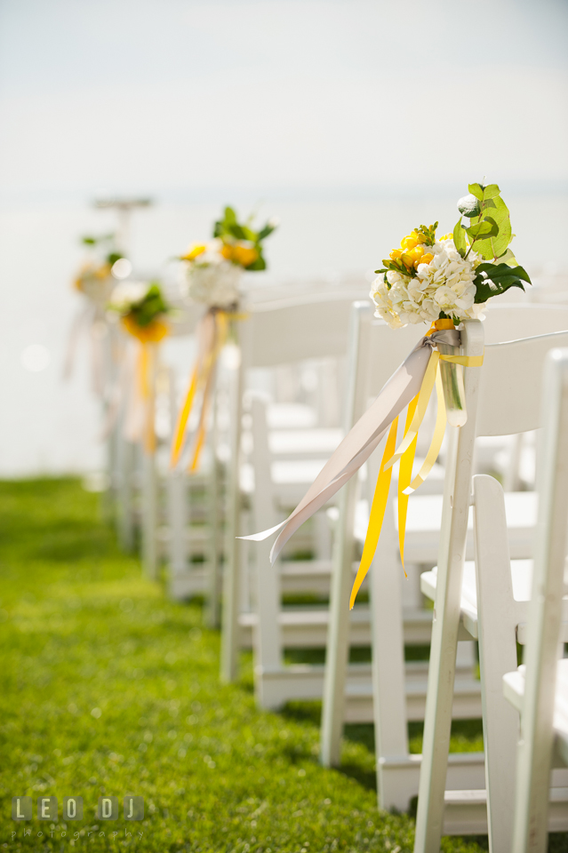 Flower decor with yellow, white, and grey ribbons for the ceremony aisle. Kent Island Maryland Chesapeake Bay Beach Club wedding photo, by wedding photographers of Leo Dj Photography. http://leodjphoto.com