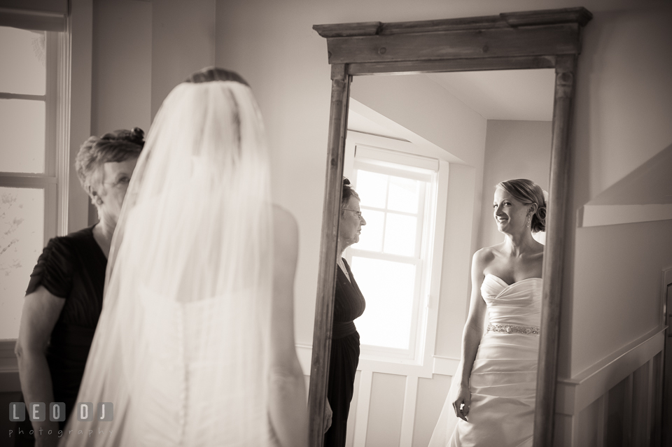 Bride checking her dress and veil on mirror with her Mother. Kent Island Maryland Chesapeake Bay Beach Club wedding photo, by wedding photographers of Leo Dj Photography. http://leodjphoto.com