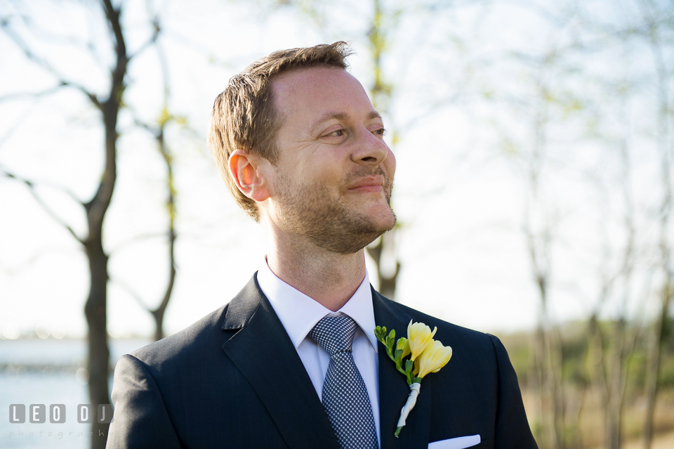 Groom seeing his Bride for the first time in her wedding dress walking down the aisle. Kent Island Maryland Chesapeake Bay Beach Club wedding photo, by wedding photographers of Leo Dj Photography. http://leodjphoto.com