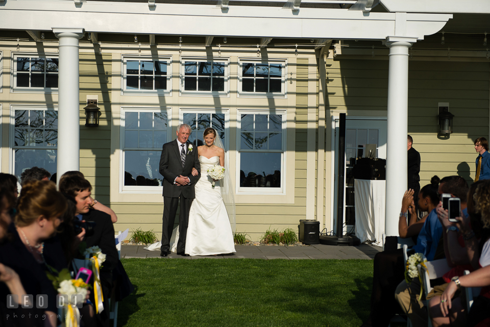 Bride walking down the aisle during processional escorted by her Father. Kent Island Maryland Chesapeake Bay Beach Club wedding photo, by wedding photographers of Leo Dj Photography. http://leodjphoto.com