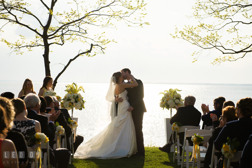 Bride and Groom kissing after officially pronounced as husband and wife. Kent Island Maryland Chesapeake Bay Beach Club wedding photo, by wedding photographers of Leo Dj Photography. http://leodjphoto.com