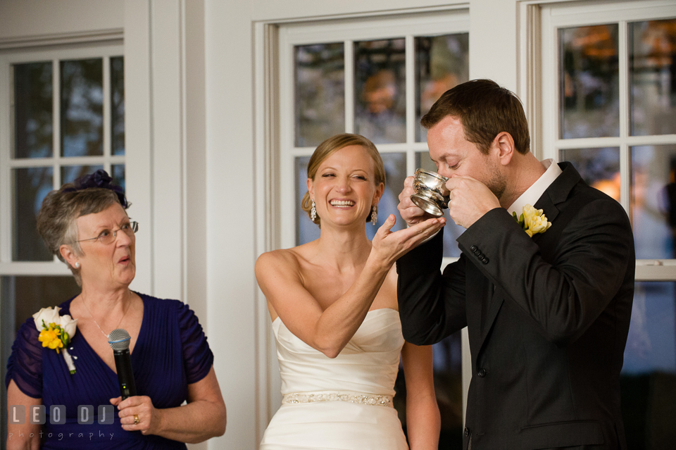 Groom drinking from the Quaich cup, Bride laughing. Kent Island Maryland Chesapeake Bay Beach Club wedding photo, by wedding photographers of Leo Dj Photography. http://leodjphoto.com