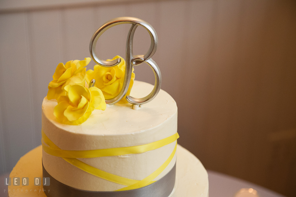 White and yellow cake with a letter cake topper designed by Peace of Cake wedding cake baker. Kent Island Maryland Chesapeake Bay Beach Club wedding photo, by wedding photographers of Leo Dj Photography. http://leodjphoto.com