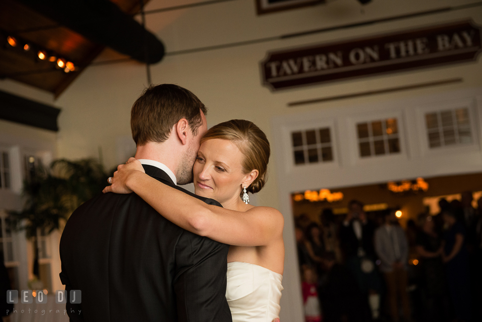 Bride and Groom hugging during their first dance. Kent Island Maryland Chesapeake Bay Beach Club wedding photo, by wedding photographers of Leo Dj Photography. http://leodjphoto.com