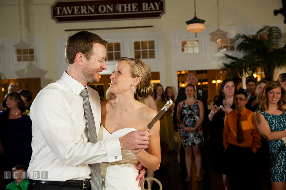 Bride and Groom laughing together during the cake cutting. Kent Island Maryland Chesapeake Bay Beach Club wedding photo, by wedding photographers of Leo Dj Photography. http://leodjphoto.com