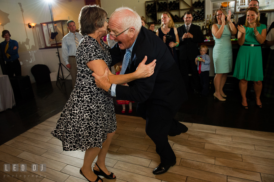 Elderly couple danced energetically during the anniversary dance. Kent Island Maryland Chesapeake Bay Beach Club wedding photo, by wedding photographers of Leo Dj Photography. http://leodjphoto.com