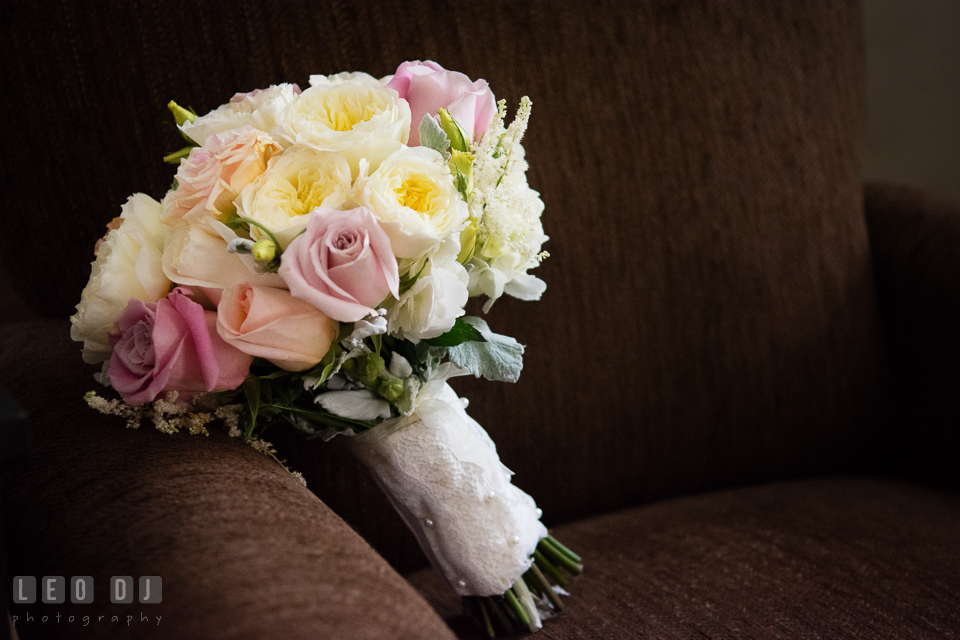 Wedding flower bouquet with white, pink, and pastel roses for the bride by Violets Florist. Historic Inns of Annapolis Maryland, Governor Calvert House wedding, by wedding photographers of Leo Dj Photography. http://leodjphoto.com