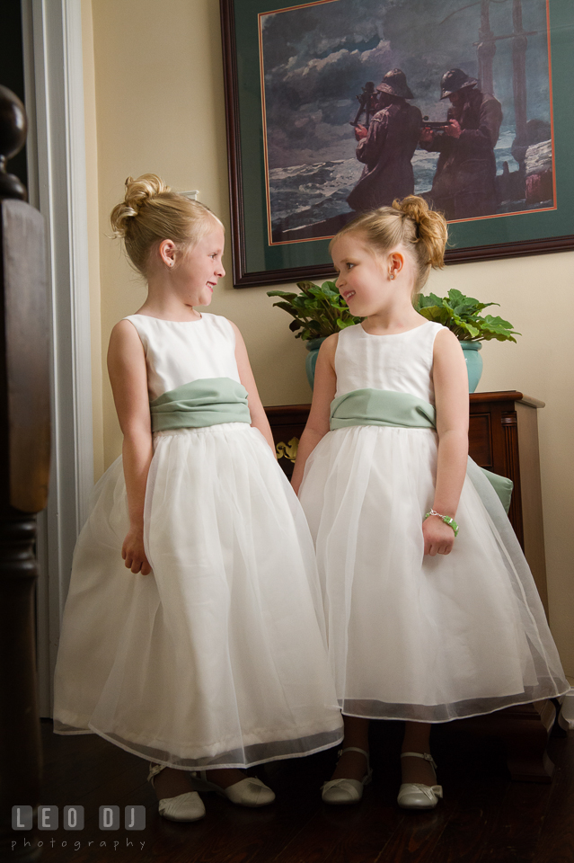 Two cute flower girls looking at each other. Historic Inns of Annapolis Maryland, Governor Calvert House wedding, by wedding photographers of Leo Dj Photography. http://leodjphoto.com