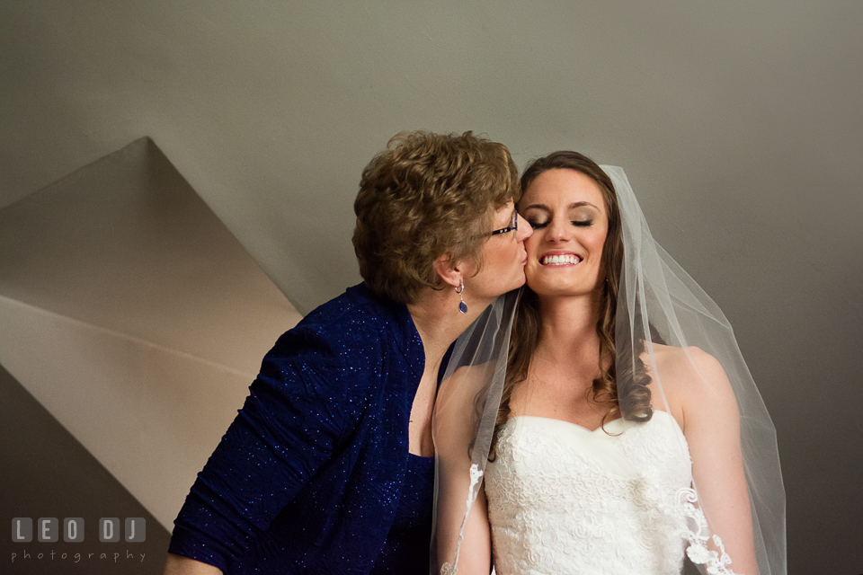 Mother of Bride kissing her daughter. Historic Inns of Annapolis Maryland, Governor Calvert House wedding, by wedding photographers of Leo Dj Photography. http://leodjphoto.com