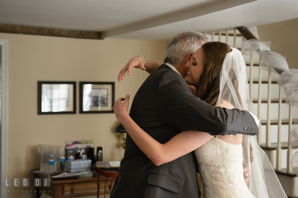 Father of the Bride and daughter hugging after seeing daughter in her wedding dress. Historic Inns of Annapolis Maryland, Governor Calvert House wedding, by wedding photographers of Leo Dj Photography. http://leodjphoto.com