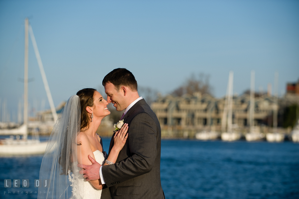 Bride and Groom getting close and hugging at the Annapolis downtown harbor. Historic Inns of Annapolis Maryland, Governor Calvert House wedding, by wedding photographers of Leo Dj Photography. http://leodjphoto.com