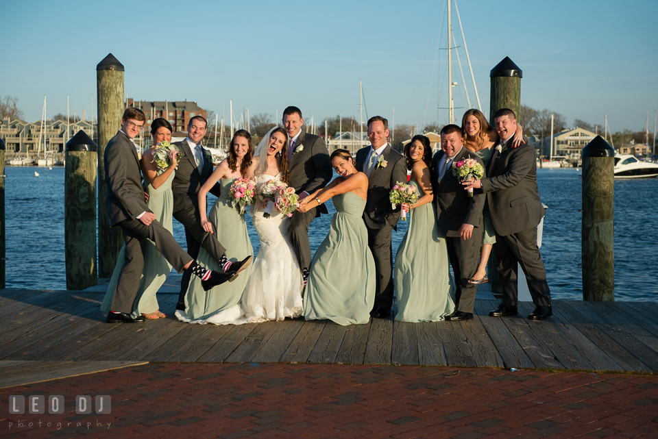 Bride and Groom with their Wedding Party doing fun and goofy post at the Annapolis dock. Historic Inns of Annapolis Maryland, Governor Calvert House wedding, by wedding photographers of Leo Dj Photography. http://leodjphoto.com